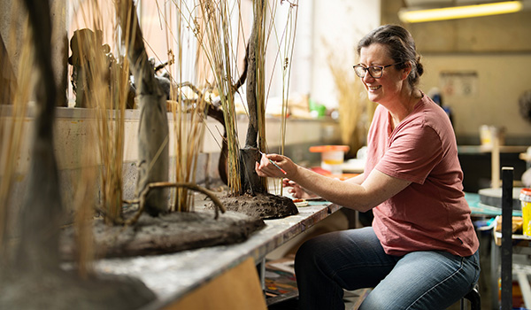 Molly Hardman works on props for an acting production at AC Arts.