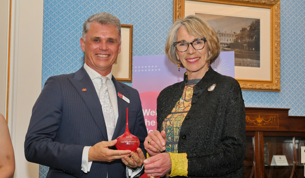 Dr Norman Baker accepting the trophy on behalf of Alierah Foley with The Right Honourable The Lord Mayor of Adelaide Dr Jane Lomax-Smith AM